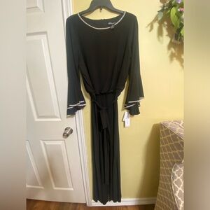 NWT Women jumpsuit with  rhinestone trim on neckline and sleeves.
